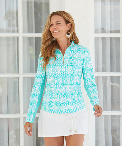 Woman wearing Sunshine Shores Sport Zip Top with White Side Tie Swim Skirt